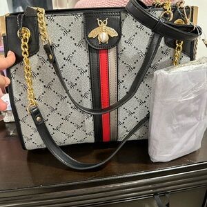 Chic Black and Red Shoulder Bag with Gold Accents